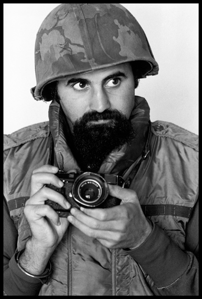 SOUTH VIETNAM. 1973. Photographer ABBAS wears helmet and flack-jacket while covering the war.